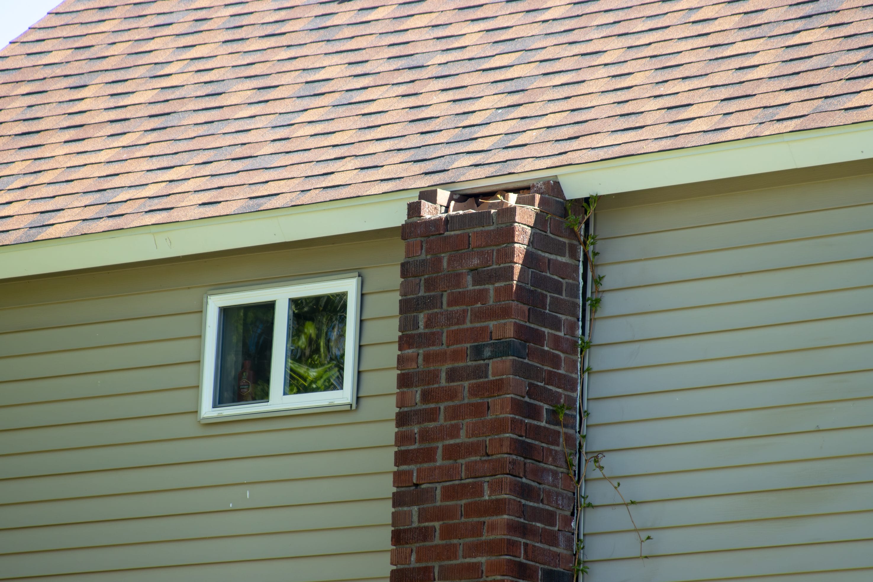 Stock image of damage that may require a chimney rebuild.