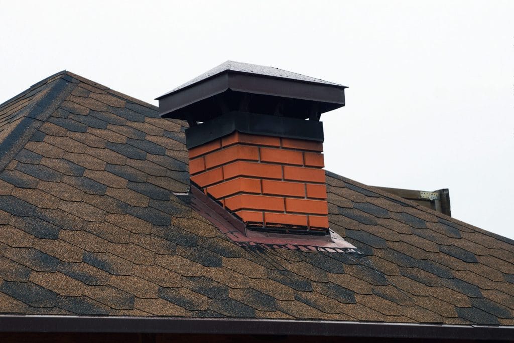 A chimney cap can protect your flue from water damage, animal intrusion, and the elements.